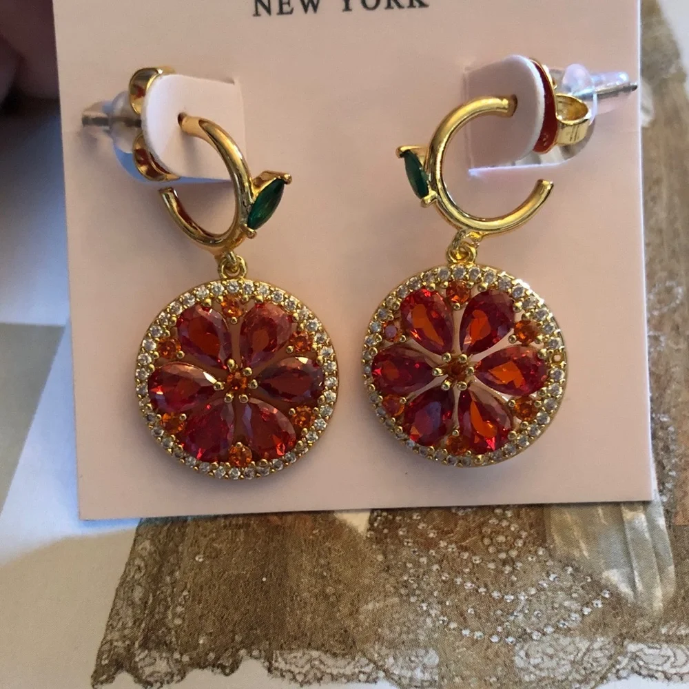 Authentic Kate Spade crystal orange design Earrings. New on card.